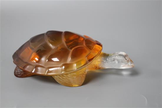 A modern Lalique amber tinted glass model of a turtle, signed with Made in France sticker, length 14.5cm